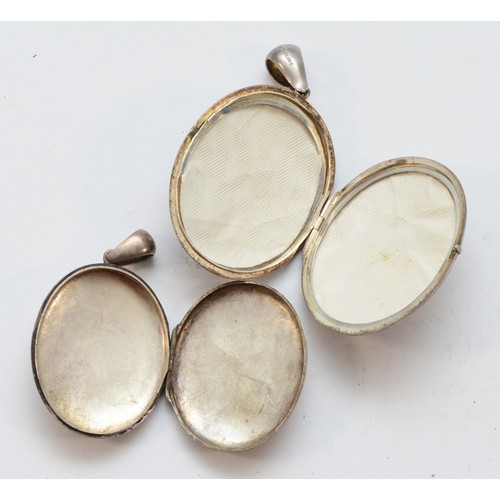 6 - A Victorian unmarked silver oval locket, 45 x 38mm and another smaller example, 27gm