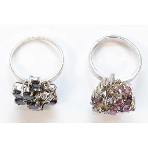 20 - A silver and sapphire abstract cluster ring, size P and a similar ruby example, N, 12gm