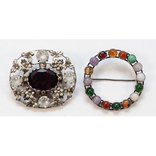 34 - An unmarked silver and multi-gemstone hoop brooch, 39mm and a silver and paste brooch, 25gm