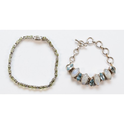 35 - A silver and peridot line bracelet , 21cm and a moonstone and blue stone bracelet, 40gm