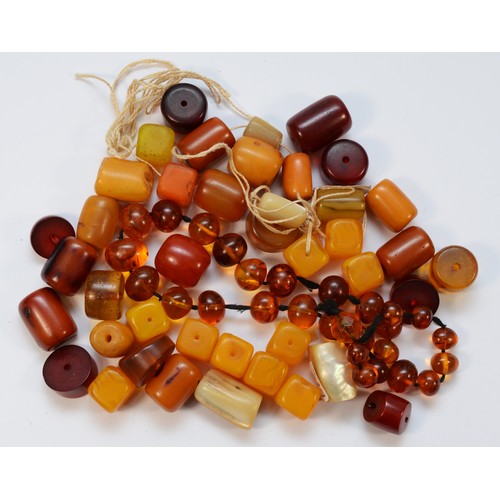 48 - A quantity of amber Bakelite beads, 364gm