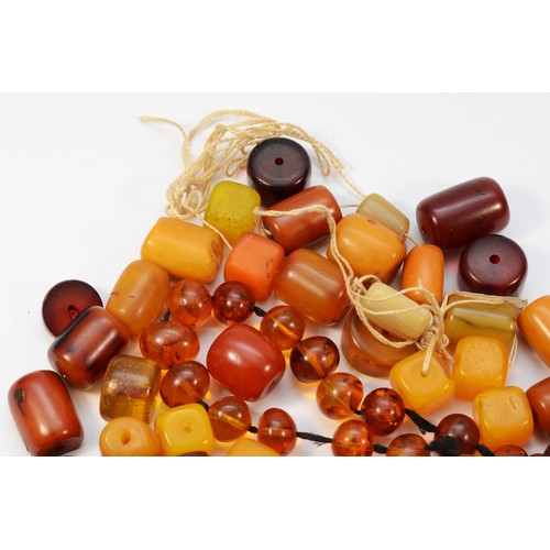 48 - A quantity of amber Bakelite beads, 364gm