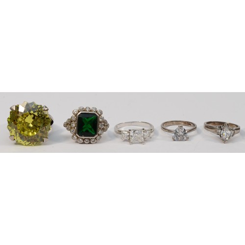 50 - A silver and yellow stone ring, 23mm, and seven other silver rings, sizes L - U, 53gm