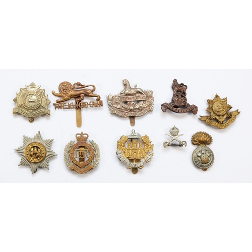 61 - Military Cap Badges (20), to include North Stafford, The Essex Reg and Inniskilling.