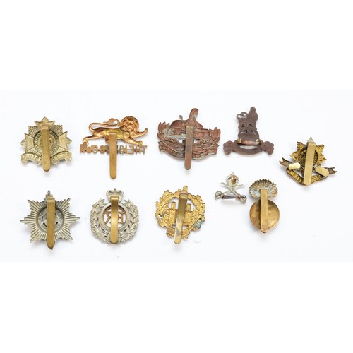 61 - Military Cap Badges (20), to include North Stafford, The Essex Reg and Inniskilling.