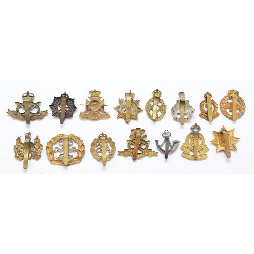 62 - A collection of 31 military and artillery cap badges, to include The Wiltshire Regiment and the Medi... 