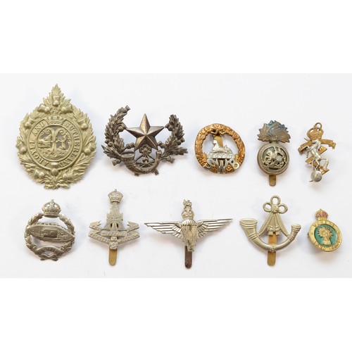 68 - Twenty Military cap badges, to include the Tank Reg and the Parachute Reg.