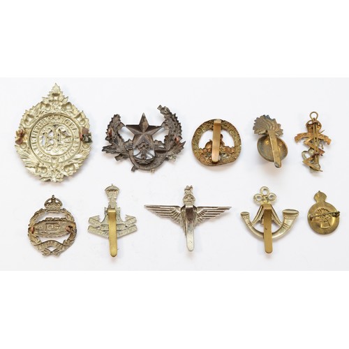 68 - Twenty Military cap badges, to include the Tank Reg and the Parachute Reg.