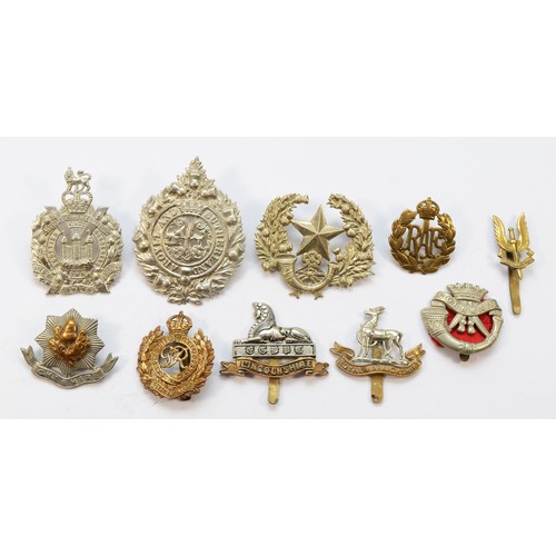 68 - Twenty Military cap badges, to include the Tank Reg and the Parachute Reg.