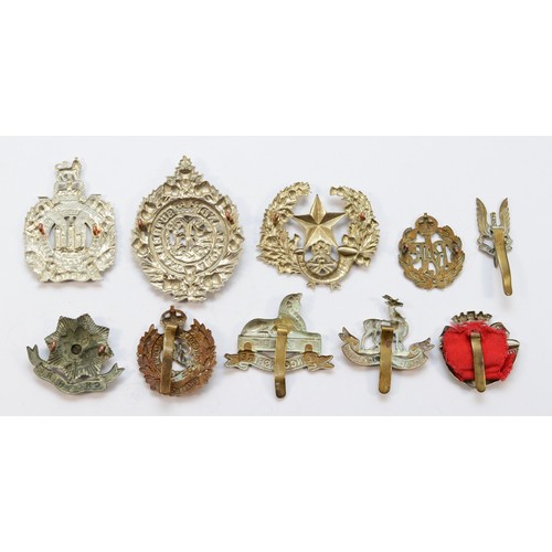 68 - Twenty Military cap badges, to include the Tank Reg and the Parachute Reg.