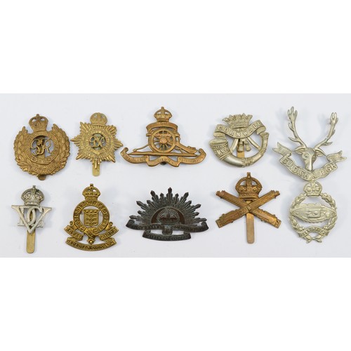 70 - Ten military cap badges, including Tank Reg and Machine Gun Corps