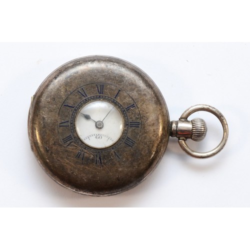 113 - A silver keyless wind half hunter pocket watch, Birmingham 1923, 49mm, working when catalogued