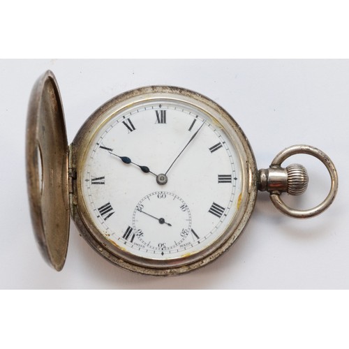 113 - A silver keyless wind half hunter pocket watch, Birmingham 1923, 49mm, working when catalogued