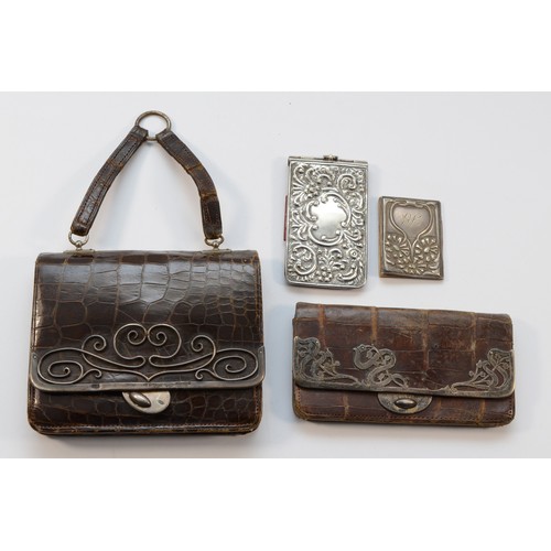 276 - Two silver mounted crocodile purses, both Birmingham import 1905 and 1902 and two other silver mount... 