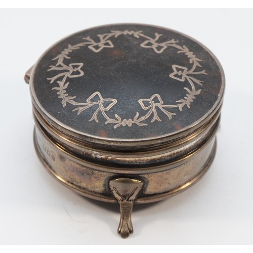 286 - A silver and tortoiseshell trinket box, London 1919, raised on three legs, diameter 7cm, loaded