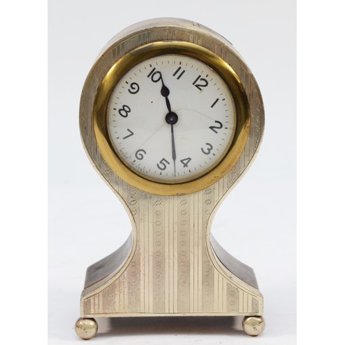 297 - A silver mounted balloon mantel clock, Birmingham 1925, with engine turned decoration, 12.5cm, movem... 