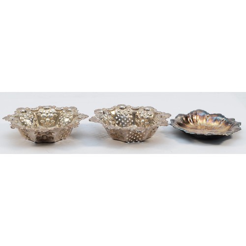 299 - An Edwardian silver pair of bon bon dishes, Birmingham 1909, diameter9cm and a silver leaf dish, by ... 