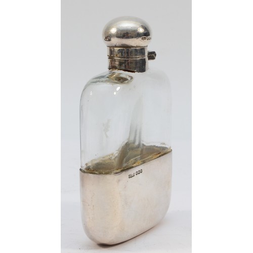 301 - A silver and glass hip flask, Sheffield 1964, with pull off cup and bayonet lid, 12.5cm