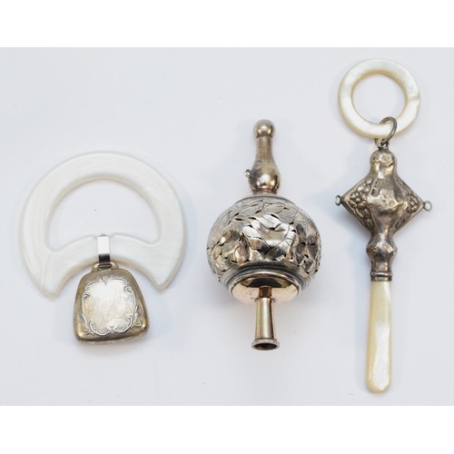 315 - A silver and mother of pearl rattle, Birmingham 1932, no bells, an Imman Sterling rattle and an unma... 