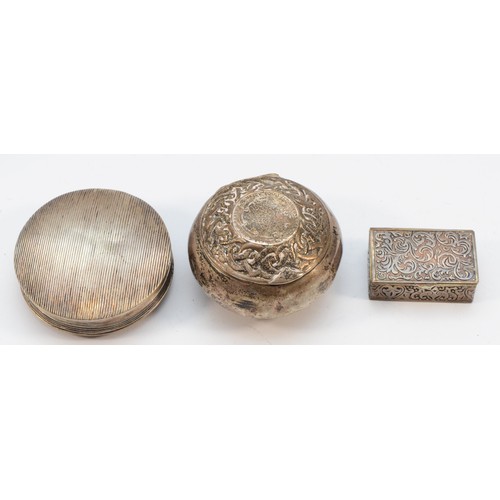 321 - A Dutch silver circular box, 5cm, a Victorian silver Celtic box, marks worn, and a 925 silver pill b... 