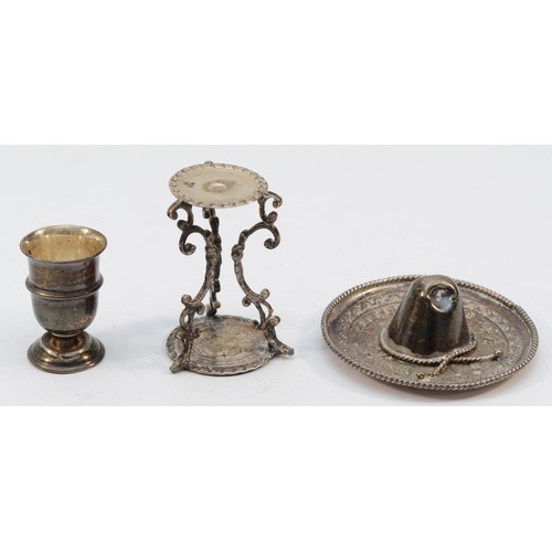 323 - A Brazilian silver coin table, 5cm, a Mexican silver hat and a silver trophy cup, 43gm