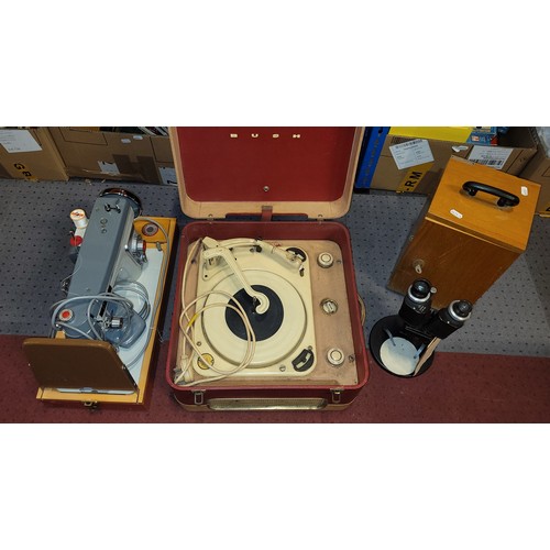 87 - A 1950s Garrard portable record player, together with a 1970s Jones sewing machine and a 20th centur... 