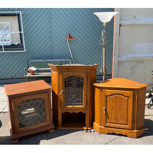 104 - A light oak corner cabinet, single leaded glass door above a single cupboard underneath, 182cm high.... 