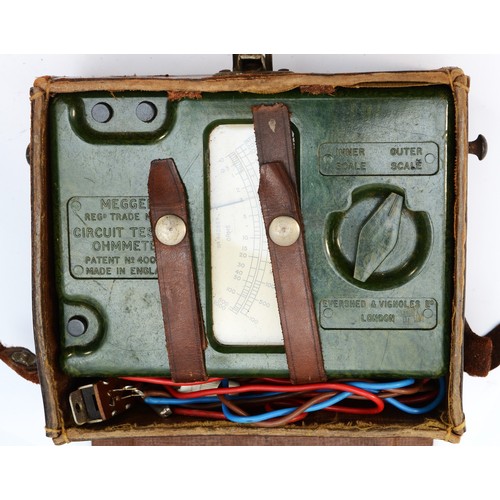 125 - An early 20th century Megger circuit testing ohmmeter, green bakelite case with original leather car... 