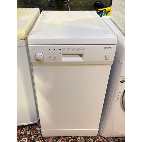 129 - A Beko slimline dishwasher, model DE2542FW (85cm high, 45cm wide, 59cm deep)