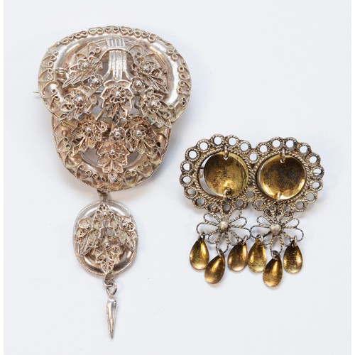 17 - A Victorian style silver filigree tassel brooch and another silver brooch, 26gm.