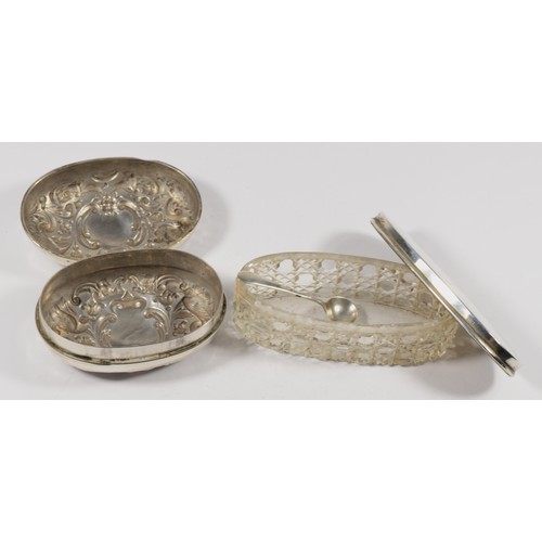 8 - A Victorian silver embossed soap holder, London 1900, 8 x 5.5 x 3.5cm, 73gm and a silver topped cut ... 