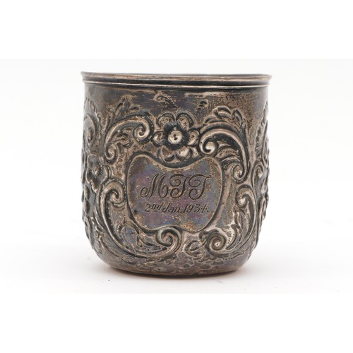 25 - An Edwardian silver christening mug, Birmingham 1909, with embossed decoration, 5.5cm, 49gm