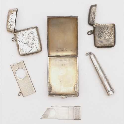 39 - Two silver vesta cases, Birmingham 1900 and 1921, a silver book match case, a silver cheroot holder ... 