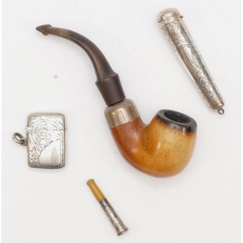 48 - An Edwardian silver vesta case, Birmingham 1903, a silver cheroot holder, a Petersons, Dublin silver... 