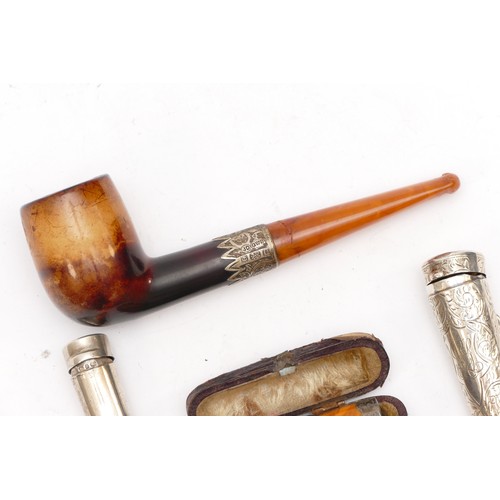 49 - An Edwardian silver mounted meerschaum pipe, Birmingham 1903, two silver cheroot holders and a chero... 