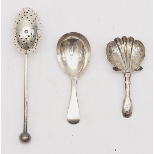 56 - An Edwardian silver tea infuser, Sheffield 1906,  a George III silver caddy spoon with shell bowl, B... 