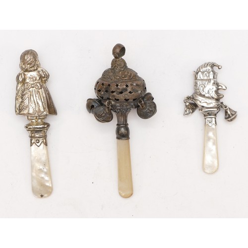 63 - A silver and mother of pearl rattle, Birmingham 1906, a Punch rattle, Chester 1959 and a 925 silver ... 