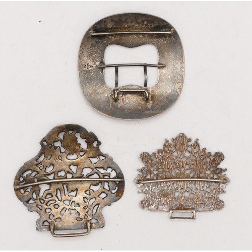 83 - Marius Hammer, an 830 standard silver buckle, 7cm and two apparently unmarked silver, 116gm part buc... 