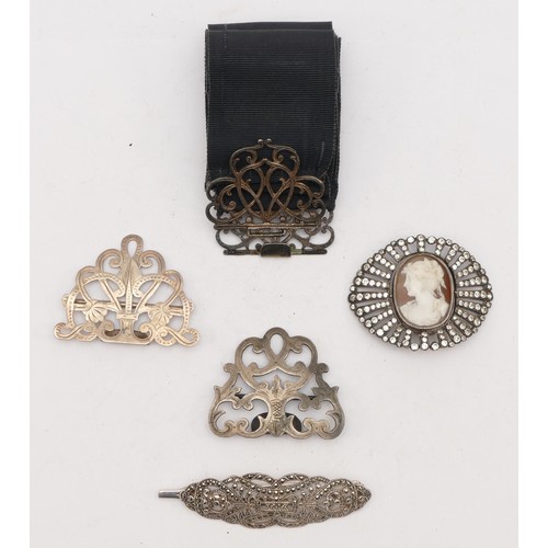 84 - A French silver, shell cameo and paste buckle, 55mm, a 925 silver and marcasite hair piece, a poorly... 