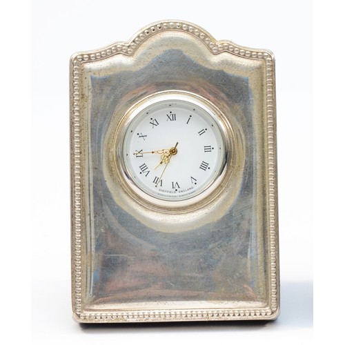 105 - A silver mounted quartz desk clock, Sheffield 2012, 9 x 6cm.