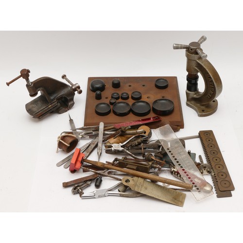 145 - National, a watchmakers press, with various attachments together with various watchmakers tools.