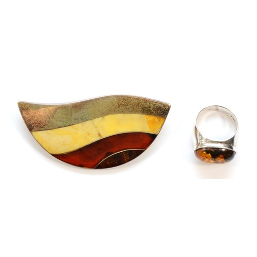 182 - A silver and banded amber brooch, 64mm and an amber set silver ring, 24gm