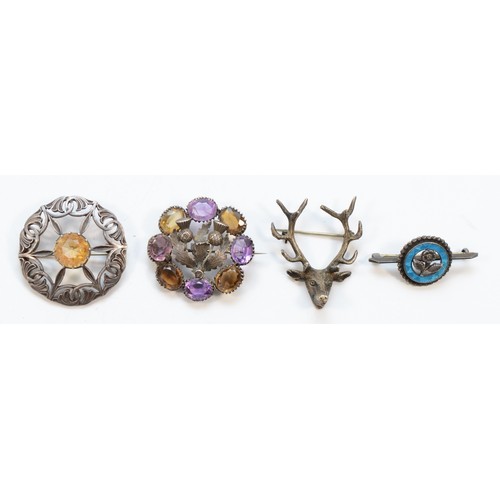 183 - A Scottish unmarked textured silver, amethyst and citrine target brooch, 38mm, an unmarked stag broo... 