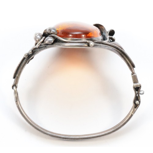 185 - A 925 silver and Baltic amber bangle, stone, 40 x 24mm, bangle 56 x 43mm, 34gm