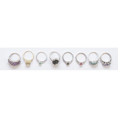 194 - A silver set single stone emerald ring and seven other gemset silver rings, 30gm