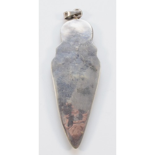 197 - An unmarked silver mounted flint arrowhead pendant with quartz above, 13cm overall