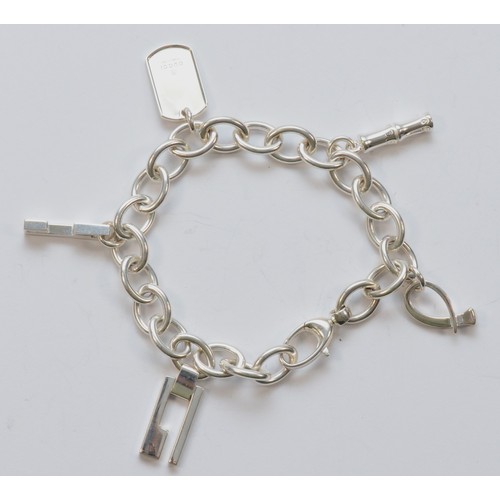 202 - Gucci, a silver charm bracelet, 20cm, 45gm