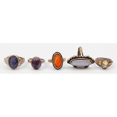 203 - A silver opal doublet ring, W and four other silver gemset rings, 28gm