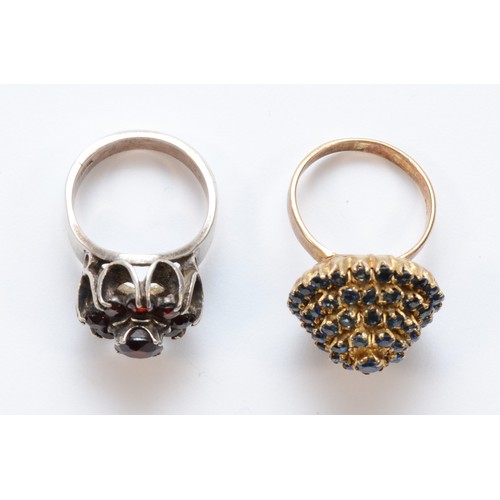 211 - A silver gilt and sapphire bombe cluster ring and a silver and garnet cluster ring, 15gm