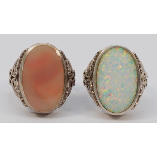 214 - David Scott Walker, Sheffield, a silver opal mounted dress ring, stone 21 x 14mmR and another by the... 